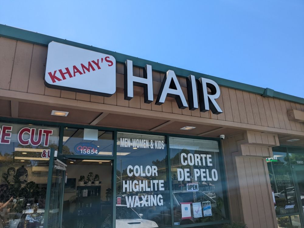 The Khamy's Hair storefront sign on Monterey Road